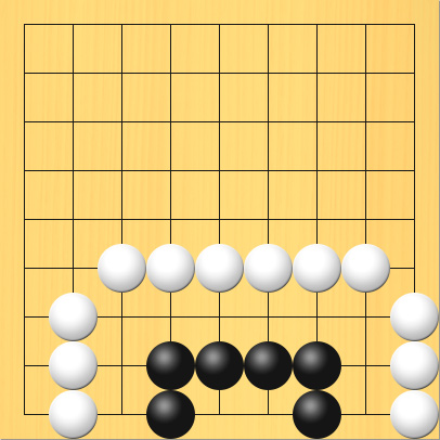 1がんで死んでいる黒石の例、その2。盤面図、黒4の9、黒4の8、黒5の8、黒6の8、黒7の8、黒7の9。白2の9、白2の8、白2の7、白3の6、白4の6、白5の6、白6の6、白7の6、白8の6、白9の7、白9の8、白9の9