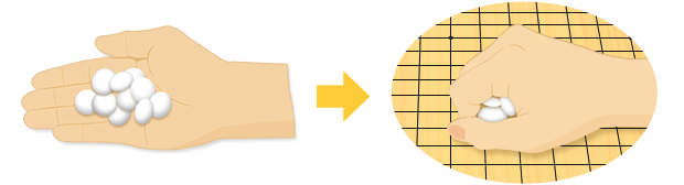 Aくんが右手で白石を握って碁盤の上に乗せている図